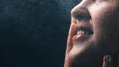 slow motion water caressing the face of ... | Stock Video | Pond5