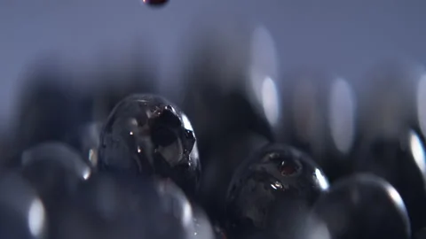 Slow Motion of Water Drop Falling on Fresh Blueberry with Splashes and Detail Stock Footage 220611476