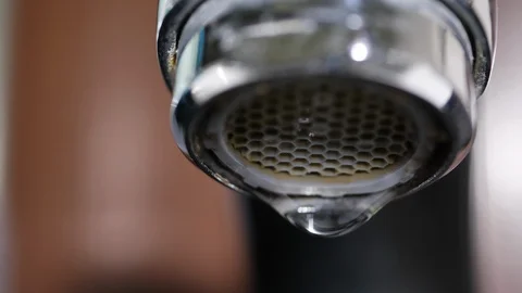 slow motion water drop leaking in close | Stock Video | Pond5