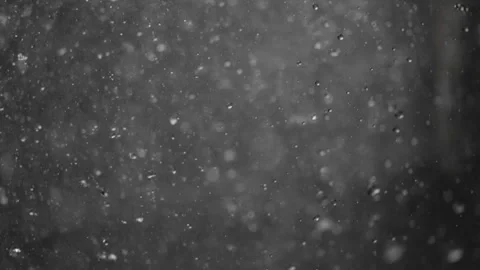 Slow-motion water droplets fall from rocky cliffs, each drop visible. In th.. Stock Footage 292563873