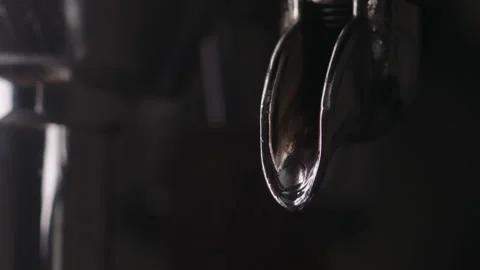 Slow motion water drops from single spout portafilter Stock Footage 164590818