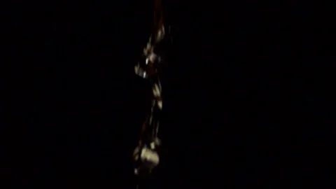 Slow motion water drops/ stream fall against a black background. Vídeos de archivo 134260517