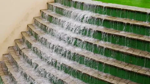 Slow motion of water falling in an artificial waterfall in a public park Video stock 276427810