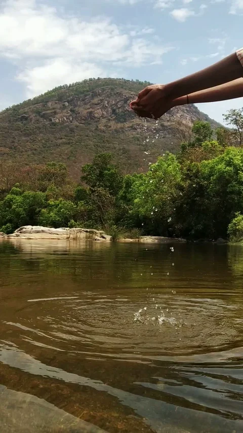 Slow motion. Water falling from hands. Surya namaskar Stock Footage 127576925