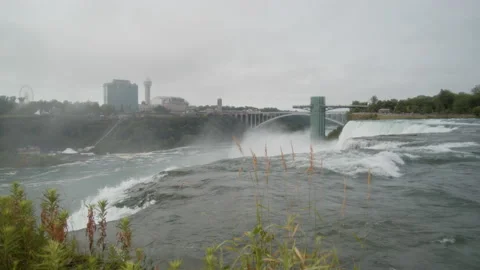 Slow motion water falling over Niagara Falls Stock Footage 157550266