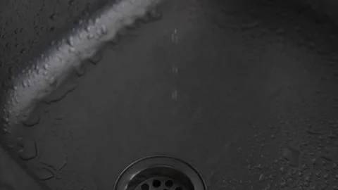 Slow motion water falling in a sink Stock Footage 339805876
