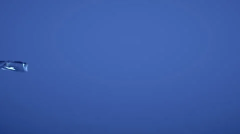 Slow motion water flow on blue background with alpha matte Stock Footage 67554815