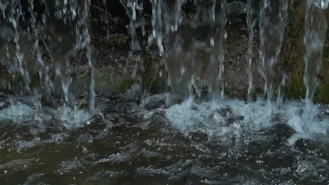 Slow motion water flow on stone Stock Footage 108470761