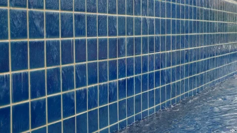 Slow motion water flowing overflow blue swimming pool Stock Footage 90422927