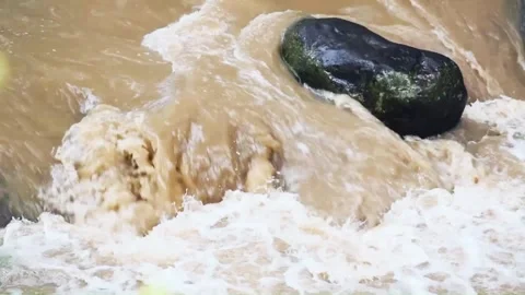 Slow motion of water flowing on the river Stock Footage 302984626