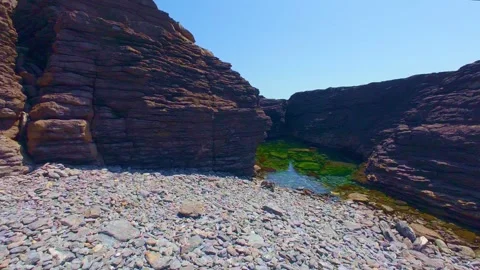 Slow motion water flowing through narrow rocky canyon gorge Stock Footage 340454318