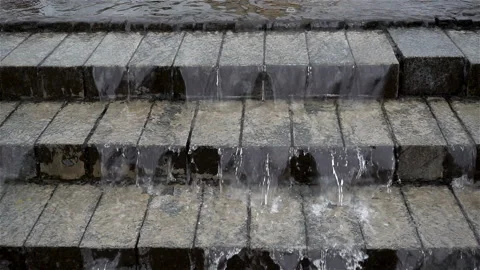 Slow motion water flows flowing down a staircase. Stock Footage 123840686