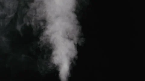 Slow motion water mist stream with wind effect over black background Stock Footage 304204397