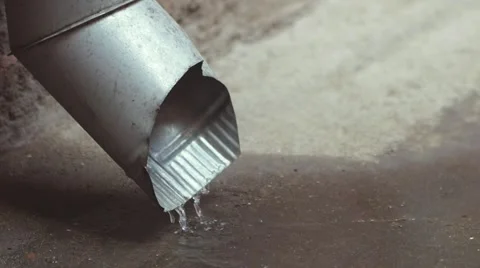 SLOW MOTION: Water pipe in the rain Stock Footage 49639104