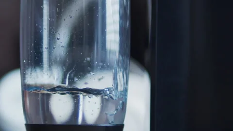 Slow motion of water pouring into a reusable bottle. Stock Footage 331859620
