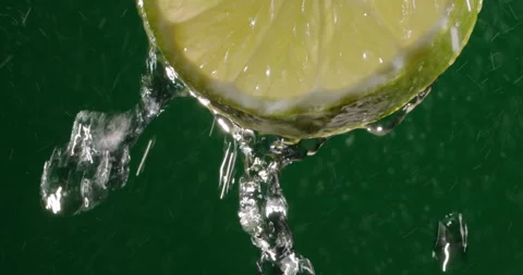 Slow motion of water running down fresh pulp of lime. Citrus fruit rich in Видео 161986798