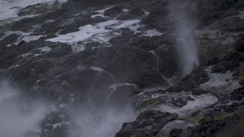 Slow-Motion Water Shooting up through Rocks Stock Footage 88718152