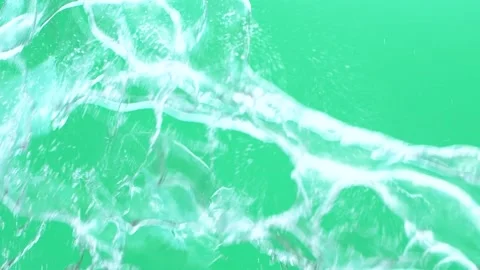 Slow motion of water spash with drops over green screen chroma key background Stock Footage 165640190