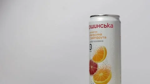 Slow motion of water splash over Morshynska orange flavored drink can Video stock 243100556
