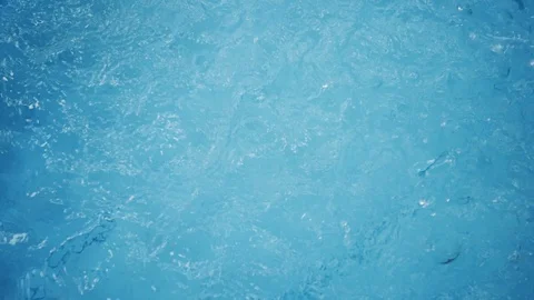 Slow motion, water splashing drop in blue swimming pool Stock Footage 109074949