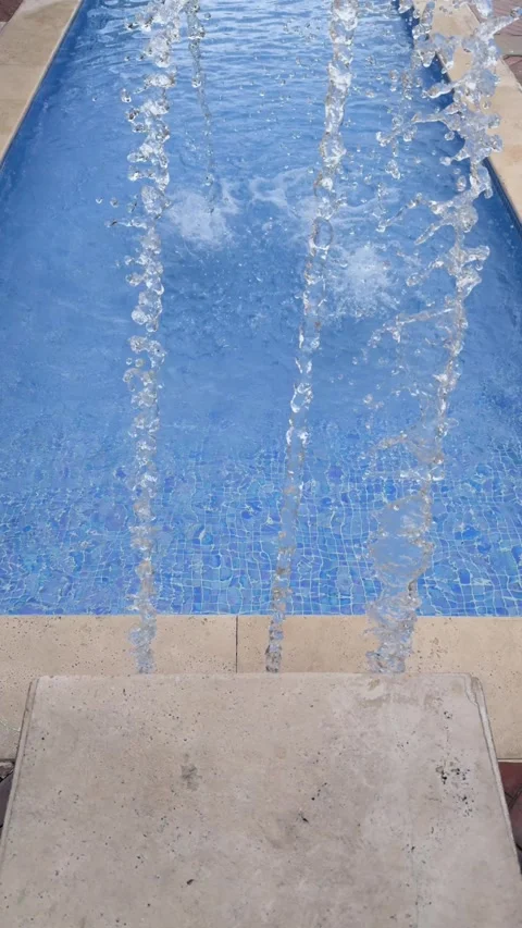 Slow Motion Water Streams Falling into Swimming Pool Stock Footage 326363307