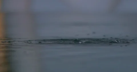 Slow motion water surface bubbling Stock Footage 123064369