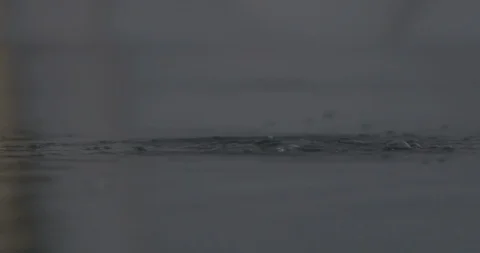 Slow motion water surface bubbling Stock Footage 123064430