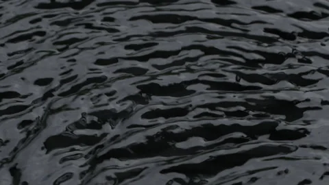 Slow motion water surface texture splash, waves and ripples on black background Vídeo Stock 275010074