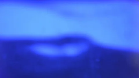 Slow motion of water surface waves with blurred bokeh towards the sunlight. Видео 91633440