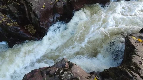 Slow motion water through rocks Stock Footage 258671067
