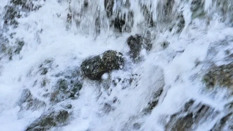 Slow motion waterfall and rock splashed by water fall Stock Footage 124390132