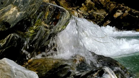 Slow motion waterfall close-up. Nature in spring. River current. Vidéo 104801242