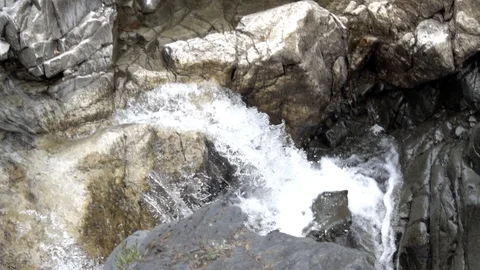 Slow motion waterfall from a distance Stock Footage 87437639