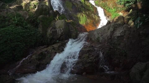 Slow Motion of Waterfall Falling Water in a Jungle Stock Footage 58621364