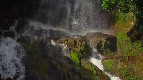 Slow Motion of Waterfall Falling Water in a Jungle Stock Footage 58621401