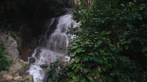 Slow Motion of Waterfall Falling Water in a Jungle Stock Footage 58621499
