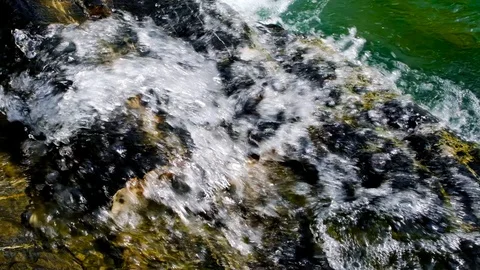 Slow motion waterfall. The flow of the river on the rocks. Vidéo 104800670
