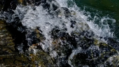 Slow motion waterfall. The flow of the river on the rocks. Vidéo 104800997