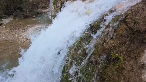 Slow Motion Waterfall Flowing Between Rocks from River Perspective 스톡 동영상 305236148