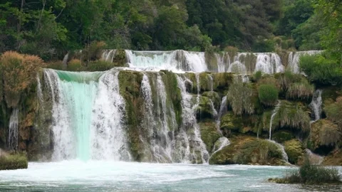 Slow motion waterfall landscape video natural lake in the middle of the forest Stock Footage 253522892
