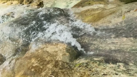 Slow motion of a waterfall with a small flow of water during the dry season Video stock 321321824