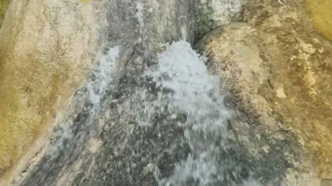 Slow motion of a waterfall with a small flow of water during the dry season Stock Footage 321321838