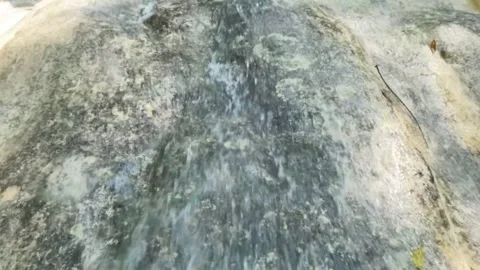 Slow motion of a waterfall with a small flow of water during the dry season Stock Footage 321321849