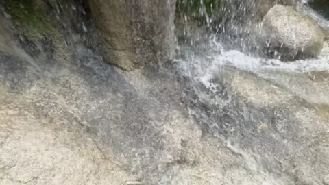 Slow motion of a waterfall splashing on limestone Stock Footage 321321864