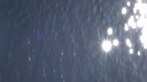 Slow motion of waterfall wall on blue cloudless sky backdrop with shining sun Stock Footage 100237156