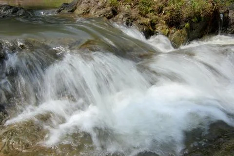 Slow motion waterfalls running at a stream Stock Photos
