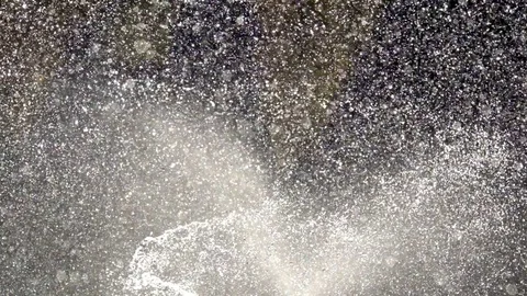 Slow motion watering by nozzle sprinker control flowing water droplet for tree Stock Footage 83691020