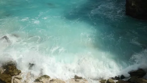 SLOW MOTION OF WAVE BREAKING OF ROCKS BLUE LAGOON Stock Footage 221670970