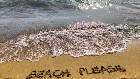 Slow motion wave erasing beach please text on sand Video stock 335758243