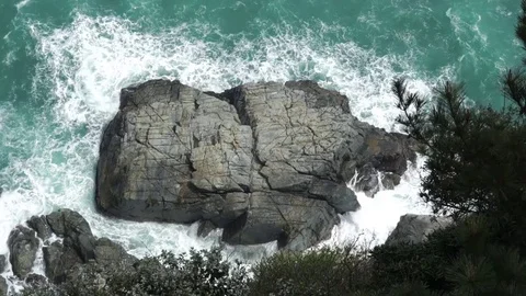 Slow motion wave hit the rock aerial view Stock Footage 78666422